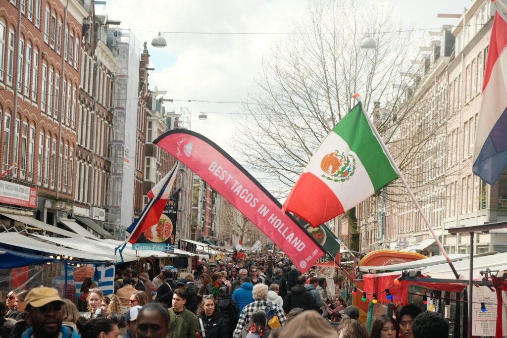 A crowd in a street food Amsterdam market