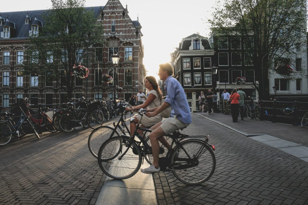 People biking through Amsterdam.
